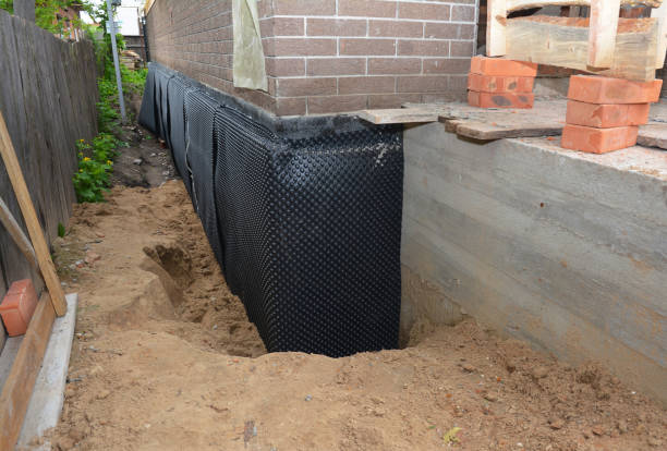 Happy homeowners after waterproofing job in Hersey
